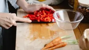 Chopping vegetables on a wood cutting board