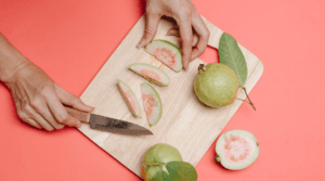 Cutting guava on a cutting board
