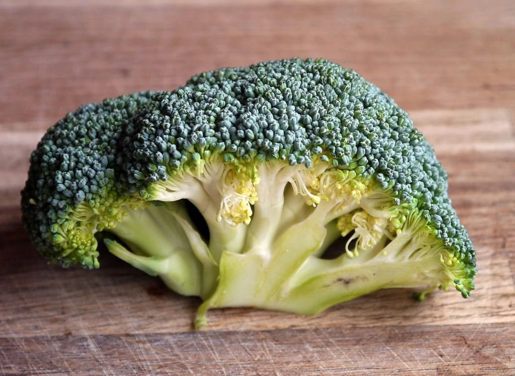 Broccoli on a wooden cutting board
