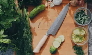 chef knife with salad contents
