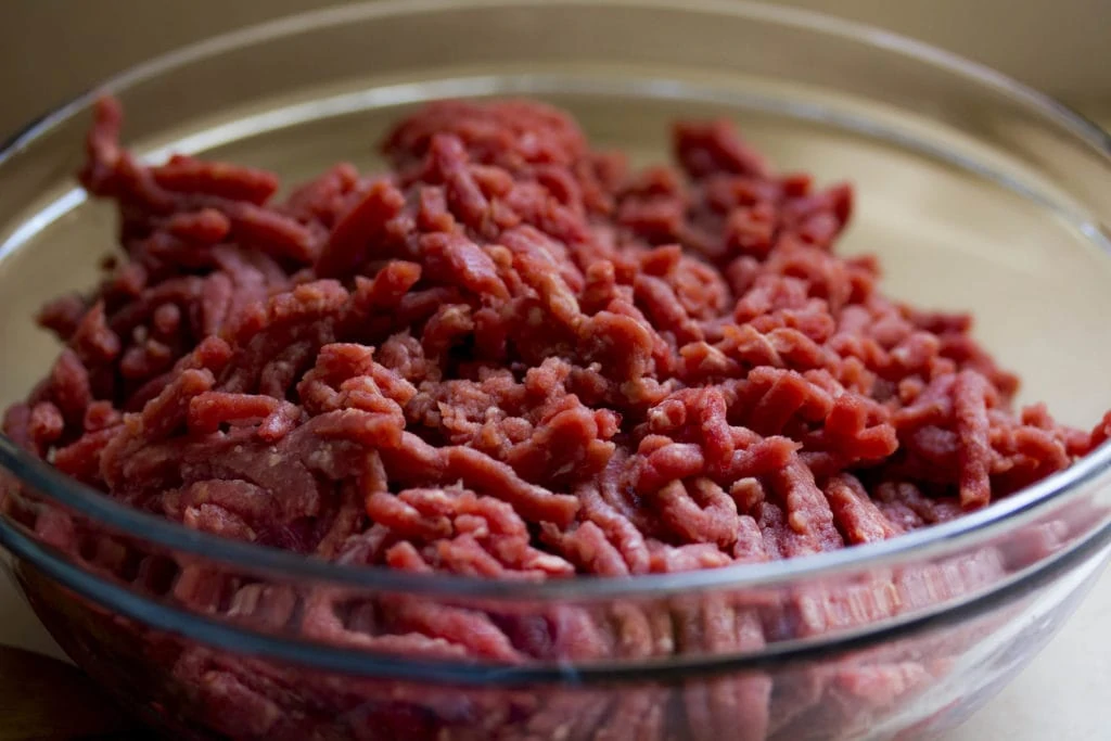raw ground beef in a glass bowl