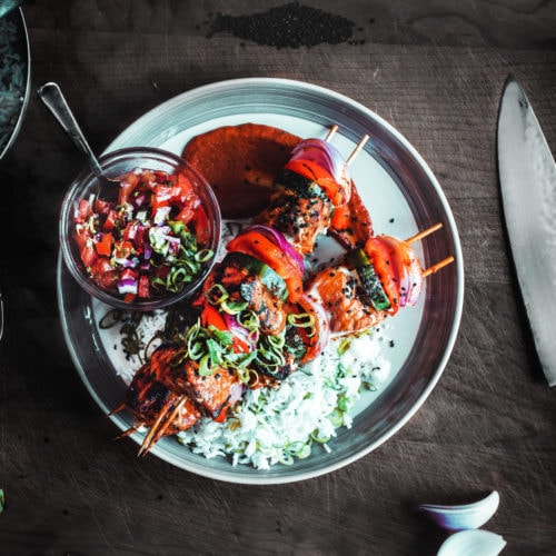 jasmine rice with two kebab skewers