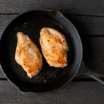 chicken breasts in a cast iron pan